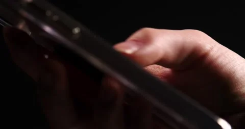 Smartphone flipping through phone close up on thumb isolated on black Stock Footage 218412287