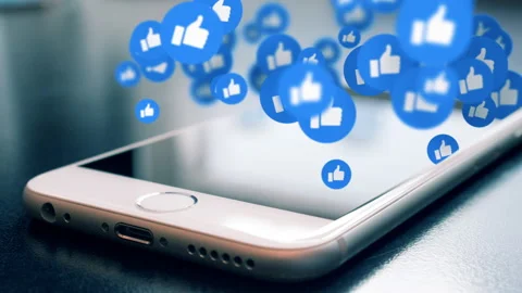 Smartphone floating social network thumbs up icons. Social media symbols Stock Footage 139701387