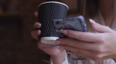 Smartphone girl using app on phone drinking coffee smiling in cafe Stock Footage 68501892