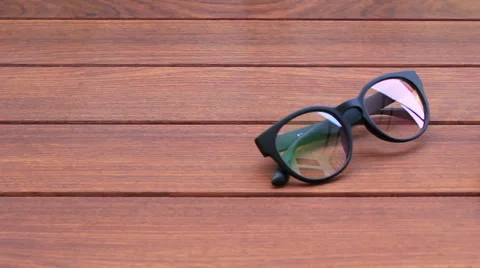 Smartphone with glasses on table Видео 64620819