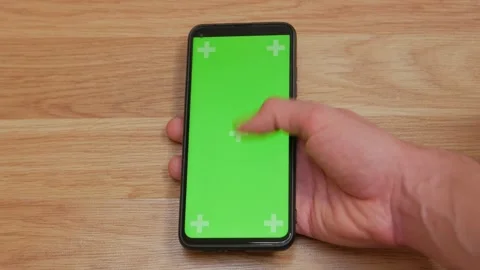 Smartphone with Green Mock-up Screen Doing Swiping Scrolling Gestures Point of Video stock 336249495