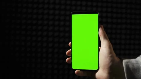 Smartphone with Green Mock-up Screen Doing Swiping Scrolling Gestures Point of Stock Footage 336249497