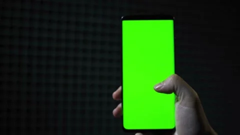 Smartphone with Green Mock-up Screen Doing Swiping Scrolling Gestures Point of Stock-Footage 336249587