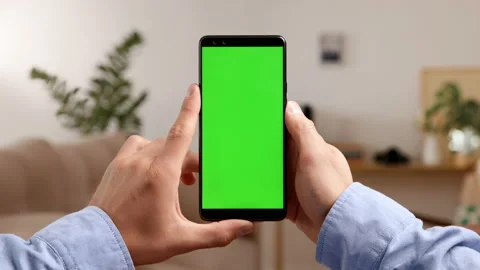 Smartphone with green screen and chroma key for watching video content. Mock-up Stock Footage 199482804