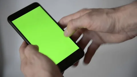 Smartphone With Green Screen and Hands Detail Stock Footage 97700580