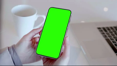 Smartphone Green Screen and Notebook Computer, Woman Using Mobile Phone Screen Stock Footage 150684949