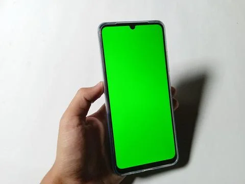 Smartphone with green screen background. Creative design template. Stock Photos