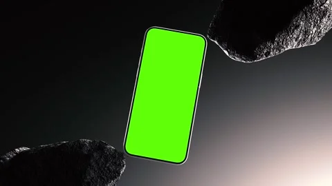 Smartphone With Green Screen Between Black Stones On Dark Background Stock Footage 315147766