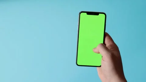 Smartphone with Green Screen on Blue Background Stock Footage 325036278