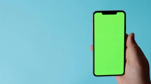 Smartphone with green screen on blue background Stock Footage 325036280