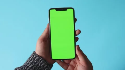 Smartphone with Green Screen on Blue Background Stock Footage 325036290