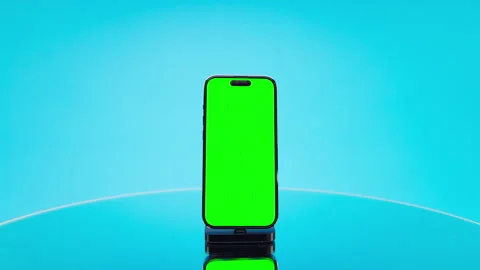 Smartphone With Green Screen On Blue Background Stock Footage 335224752