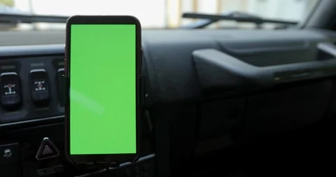 Smartphone with a green screen in the car Stock Footage 110978286