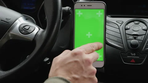 Smartphone with green screen in car interior Stock Footage 315645823