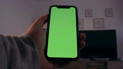 Smartphone with green screen, chroma key. iPhone X or XS Max vertical Stock Footage 158595995