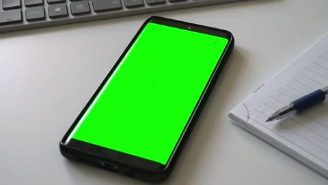 Smartphone with green screen chromakey on white desk. Stock Footage 340890366