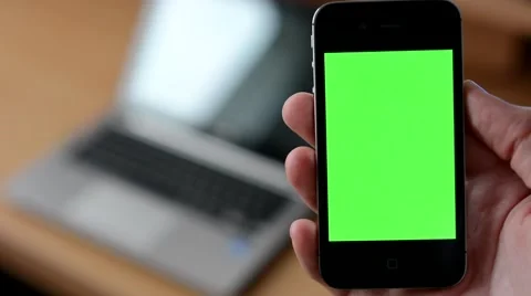 Smartphone green screen - computer (laptop) in background Video stock 44418178