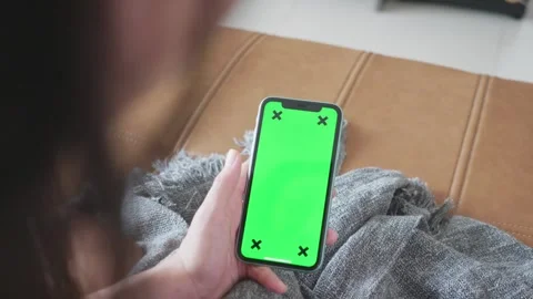 Smartphone with a Green Screen on a Couch Stock Footage 315975343