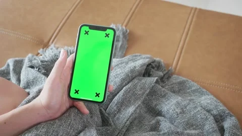 Smartphone with Green Screen on Couch Stock Footage 316073096