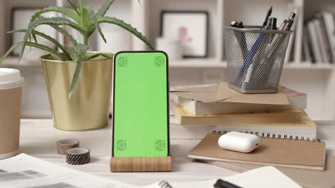 Smartphone with Green Screen in Cozy Office Interior Stock Footage 172012142