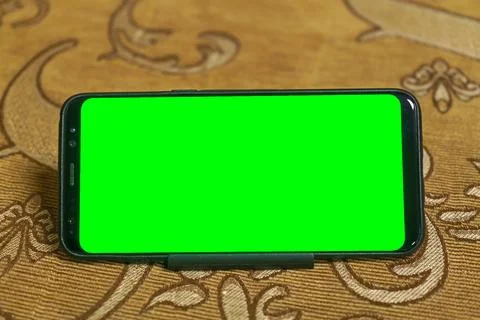 Smartphone with green screen display for mock-ups to use in a graphic design Stock Photos