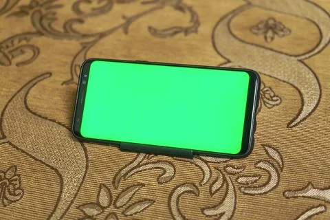 Smartphone with green screen display for mock-up to use in a graphic design Stock Photos