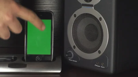 Smartphone With Green Screen In A Dock Playing Music, Speakers, Bass, Close Up Video stock 36793106