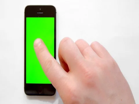 Smartphone with green screen, hand clicks Stock Footage 73854542