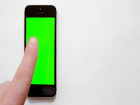 Smartphone with green screen, hand clicks Stock Footage 73854607