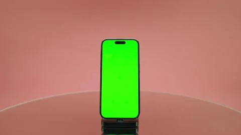 Smartphone With Green Screen Mockup Display on Pink Stock Footage 335019035