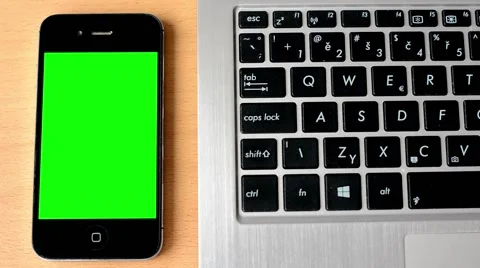 Smartphone - green screen - notebook keyboard Stock Footage 44418669