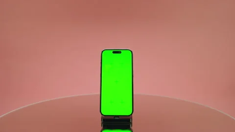 Smartphone With Green Screen on Pink Background Stock Footage 334838570