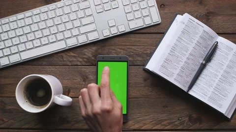 Smartphone green screen on table Stock Footage 63377039