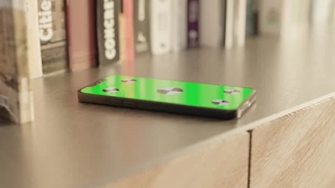 Smartphone with a Green Screen on the table Stock Footage 253636915
