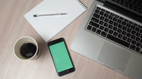 Smartphone Green Screen On Workplace Table. Top View Stock Footage 91662385