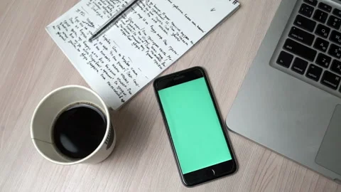 Smartphone Green Screen On Workplace Table. Top View Stock Footage 91662388