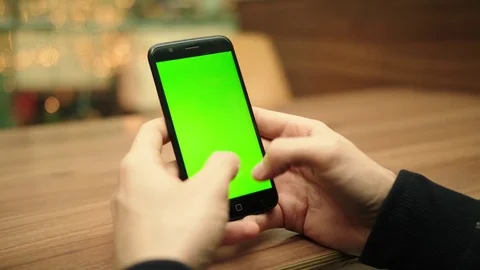 Smartphone Greenscreen typing and browsing Stock Footage 84688870