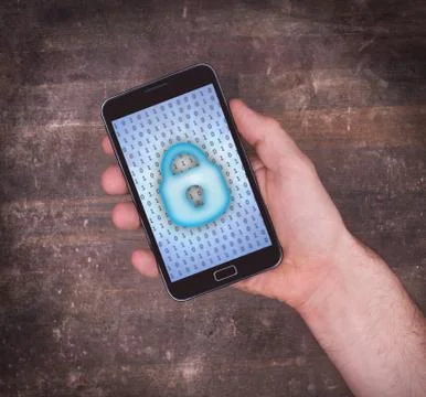 Smartphone in hand, concept of data protection Photos