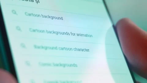 Smartphone in hand, I'm looking for information on the internet about cartoon Video stock 230948314