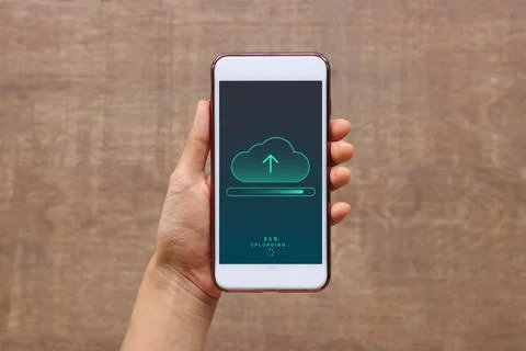 Smartphone on hand opening cloud uploading concept on phone screen. woman or  Stock Photos