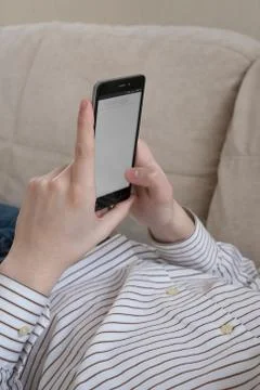 Smartphone in the hands of boy Foto stock
