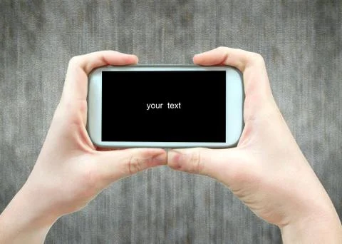 Smartphone in the hands of a man Stock Photos