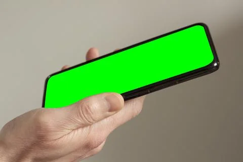 Smartphone in the hands of a man Stock Photos