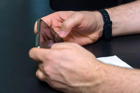 Smartphone in the hands of a man Stock Photos