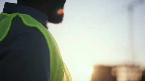 Smartphone in hands of professional builder or architect in construction site Stock Footage 318709690