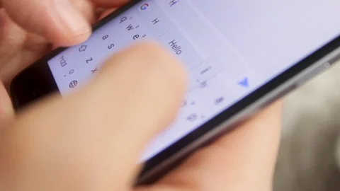 Smartphone in the hands. Texting a message, soft focus background Stock Footage