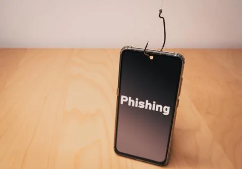 Smartphone hanging on a fish hook Foto stock