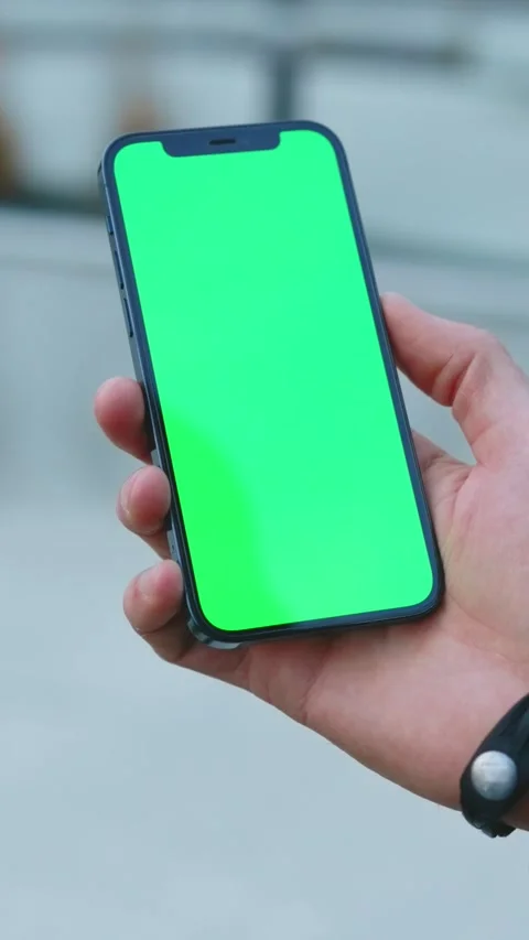 This smartphone has a vibrant green screen ideal for app development and design Stock Footage 314150976