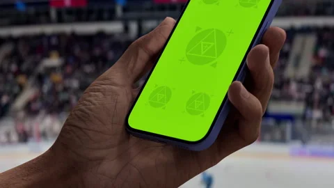 A smartphone held in a cozy home environment with modern decor Stock Footage 294038366