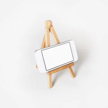 Smartphone on holder Foto stock